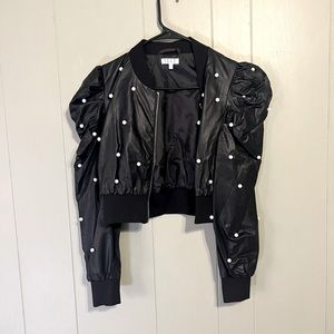 Cropped black boutique jacket.